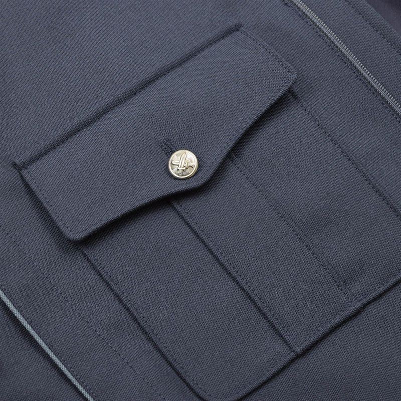 buttoned front pockets with insignia